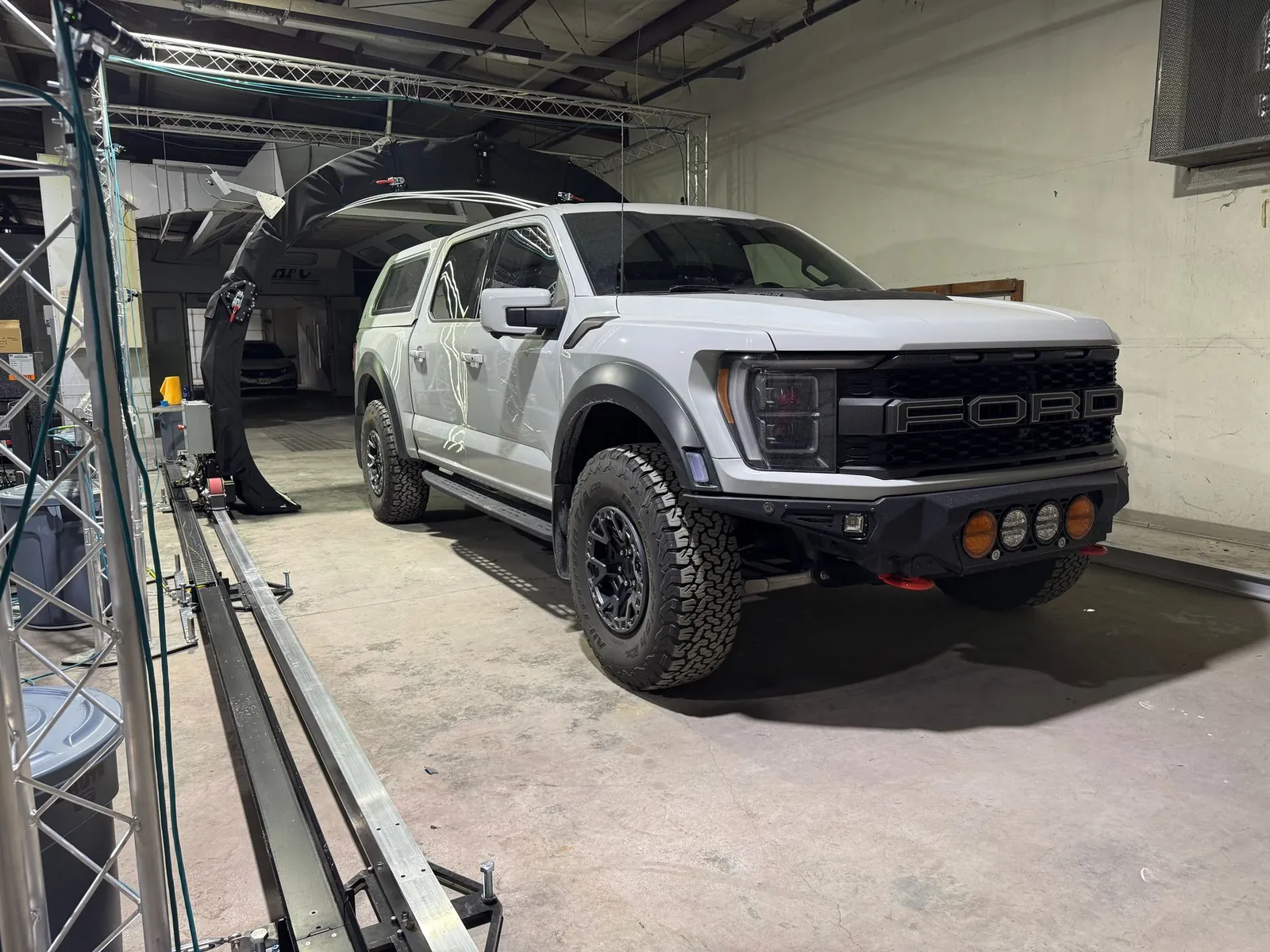 A pickup truck being scanned for hail damage at The Dent Barn